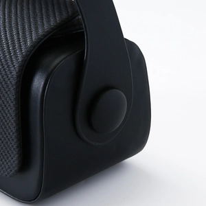 Close-up of the elegant textured weave and smooth matte leather on this luxury box bag