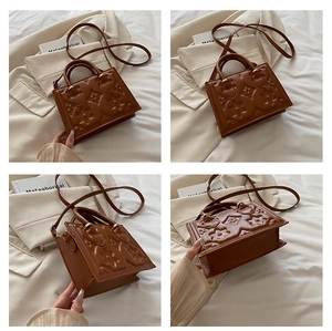 Detailed views of the brown embossed square handbag with metallic hardware and long strap