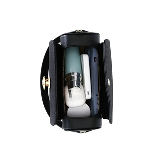 Top view of black textured box bag showing interior storage capacity for essentials