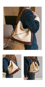 Detail view of large capacity faux leather backpack showing stitching and contrast zipper pocket