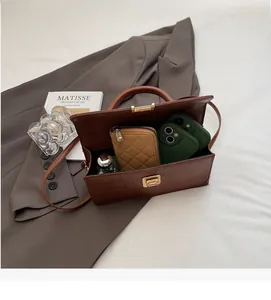 Detailed interior of a brown crocodile embossed bag showing its spacious capacity