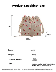 Size chart showing bucket bag dimensions with cherry print pattern and strap length details