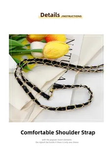 Detail of elegant black leather interwoven with gold chain strap for shoulder bag