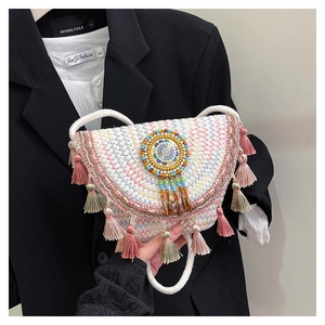 Ethnic woven shoulder bag with colorful wavy patterns and vibrant tassel fringe detail