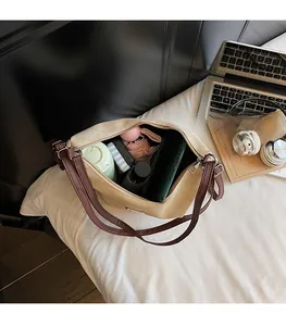 Top view of spacious tote bag interior holding phone, umbrella, and daily essentials