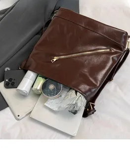 Macro view of large coffee tote bag showing spacious interior with laptop and essentials