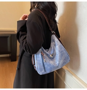 Fashionable large capacity tote bag in light blue marble texture with dual brown straps