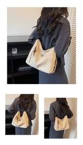 Detail showing beige versatile tote used as a shoulder bag and backpack with zipper pockets