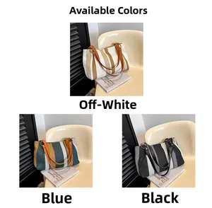 Close-up of canvas striped tote bags in beige blue and black colors with wide straps