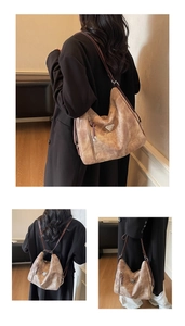 Detail of vintage khaki tote bag featuring iconic triangle logo and versatile straps