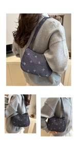 Detailed embroidery of colorful mini bows on dark blue denim underarm handbag
