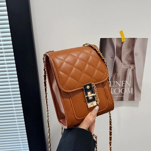 Elegant brown quilted square crossbody bag with gold chain strap and metal lock detail