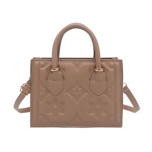 Classic small square handbag in light brown leather with elegant floral embossed pattern