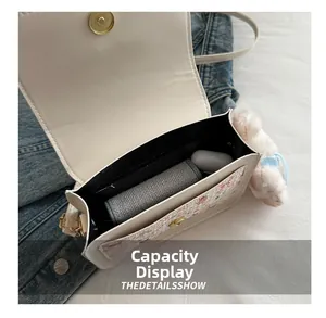 Internal view of cartoon square bag showing spacious capacity and smooth magnetic closure