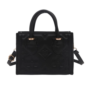 Classic black embossed square handbag with floral monogram and gold metal buckles