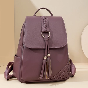 Deep purple faux leather backpack with tassel detail and textured finish for women