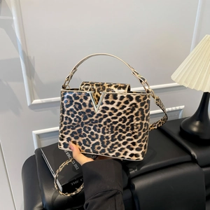 Fashionable leopard print handbag with gold V-detail and crossbody strap for women