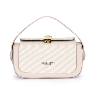 Beige luxury box bag with golden shell lock and leather top handle on white background