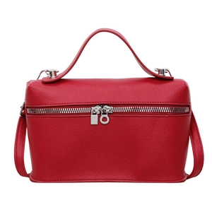 Minimalist red leather box handbag with silver zipper hardware and top handle design