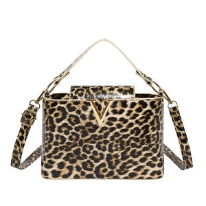 Fashionable leopard print shoulder bag with gold V buckle and adjustable strap