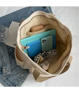 Top view of large canvas tote bag showing spacious interior with zipper pocket