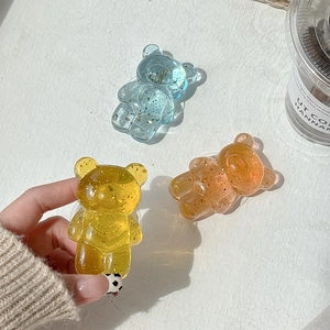 Transparent bear resin phone socket with gold leaf flakes in yellow and blue