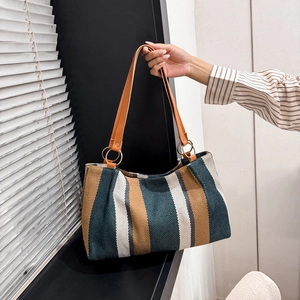 Retro striped canvas tote bag with brown leather handles for autumn travel commuting