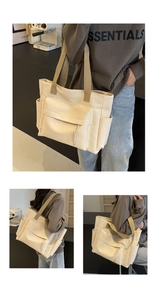 Detail view of large canvas tote bag showing multiple pockets and drawstrings for daily use