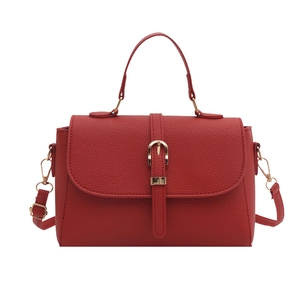 Red lychee texture leather handbag with gold buckle and adjustable shoulder strap