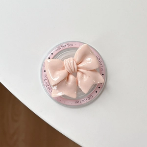 Detailed view of pink bow magnetic phone grip with Gift For You transparent base