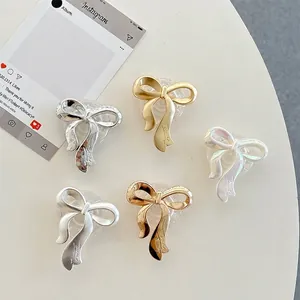 Polished and matte bow-shaped telescopic phone sockets in five metallic finishes
