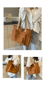 Detail view of caramel canvas tote bag with woven straps and front pocket with tassel