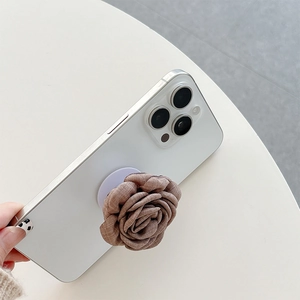 Detail of 3D fabric rose flower expandable phone grip mounted on a white smartphone