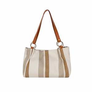 Vertical striped tote bag with brown leather handles and metallic ring connectors
