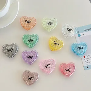 Glitter heart phone socket set with bow design in various vibrant pastel colors