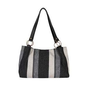 Minimalist striped canvas tote bag with black leather straps and golden metal rings