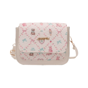 Front view of cream cartoon crossbody bag with floral bear prints and gold hardware