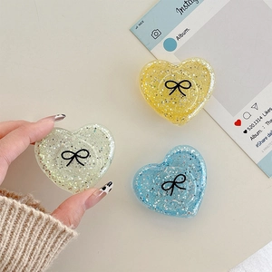Glitter heart phone socket set with bow pattern in yellow, mint green, and blue colors