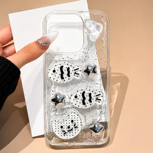 Detail showing creative iPhone case with silver glitter, fish and star resin charms