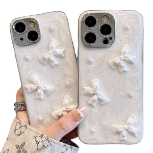 White marble iPhone case with 3D bow and pearl accents for iPhone 16 15 14 Pro Max