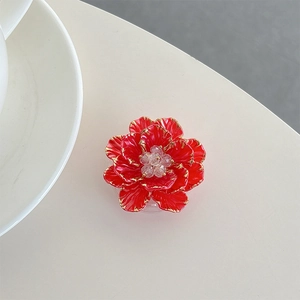 Detailed view of 3D red flower phone socket with gold edges and crystal center
