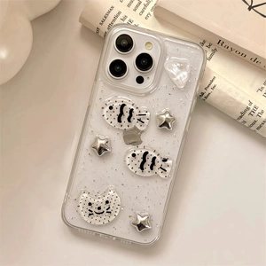 Glitter iPhone case with 3D cat and star charms on an aesthetic background