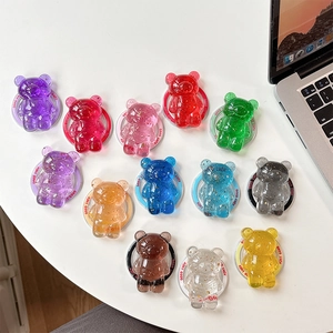 Detail of 3D bear phone holders in various colors with gold foil and Good Luck text