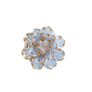 3D floral phone socket grip with light blue petals, gold edges and crystal center piece