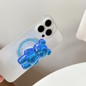 Supporto per telefono a forma di orso blu glitterato su smartphone bianco in resina