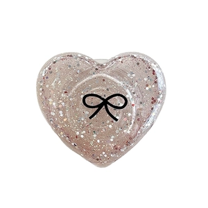 Glittery heart phone grip with bow pattern and iridescent sequins for mobile devices