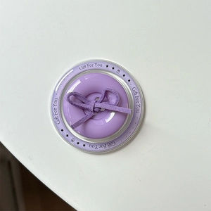 Macro shot of purple button bow phone grip with Gift For You decorative text design
