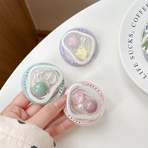 Detail of colorful resin gemstone magnetic phone grip with pearls and Gift For You text