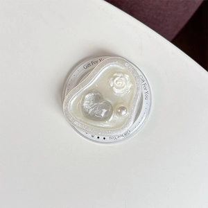 Close-up of heart-shaped magnetic phone grip with 3D white rose and pearl accents
