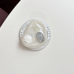 Detail of magnetic phone socket with pearl resin, white roses and butterfly elements